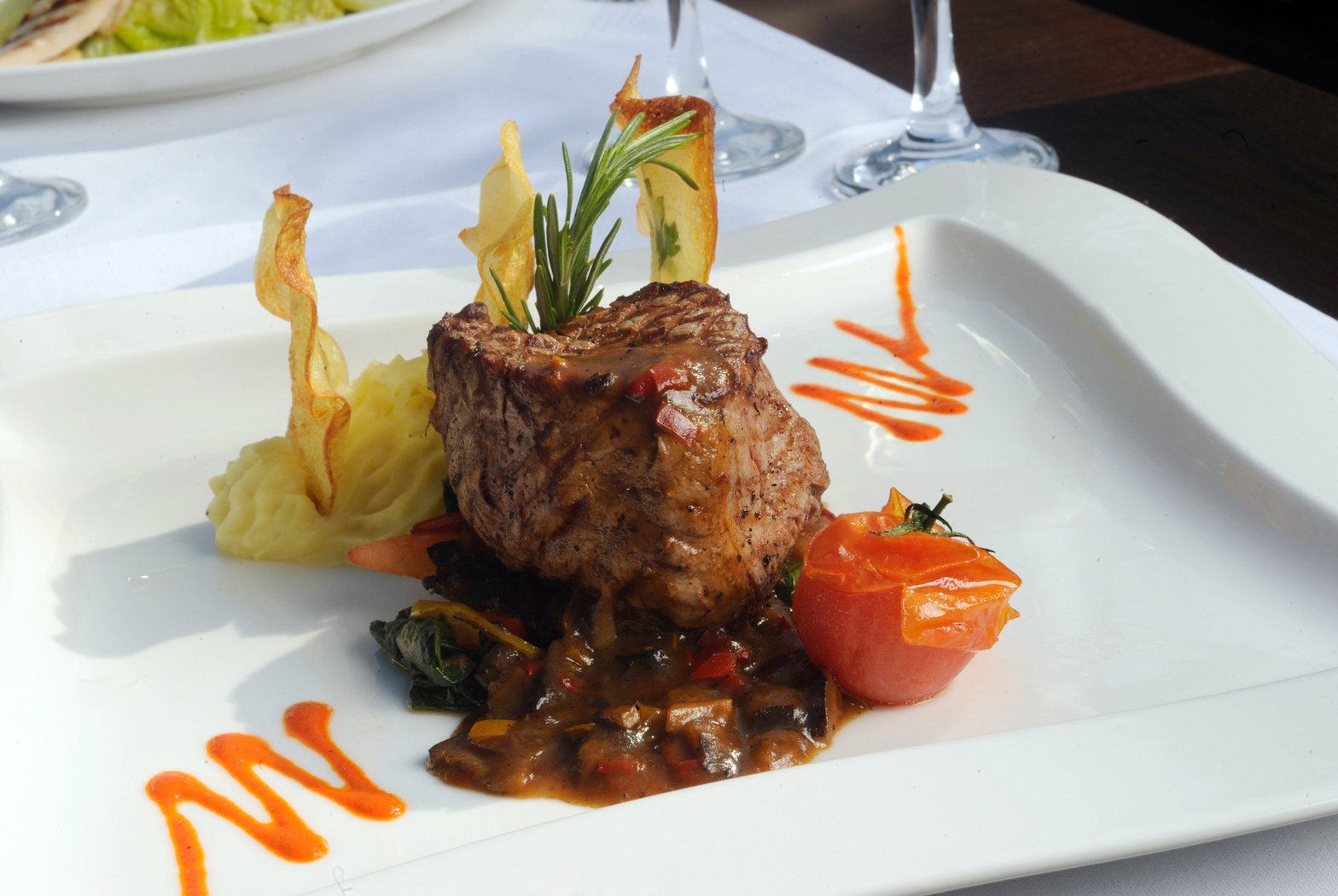 Fine restaurant dinner table place setting: beef